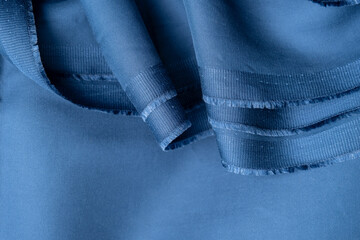 Blue  fabric with fringed edge