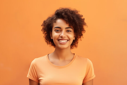 Portrait young woman from Amazonas, Manaus, Native to Brazil with a beautiful smile on her face. orange background, Brazilian woman.