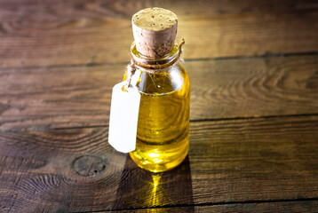 Flax seeds and a bottle of linseed oil on a wooden background. An alternative source of omega 3...