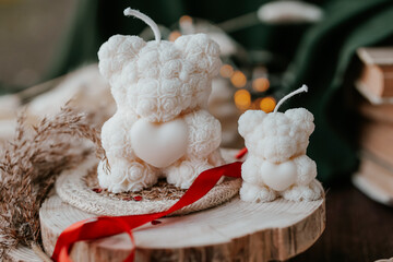 Bear shaped soy wax candles in the dark room, vintage decorations around