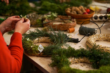 Process of making Advent wreath, natural materials only, such as moss and dried orange slices 