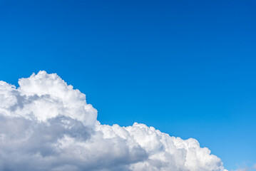 Naklejka na ściany i meble Heap beautiful white clouds against a blue sky. Aerofon. Background for wallpaper