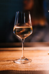 glass of wine on a table - 755000552