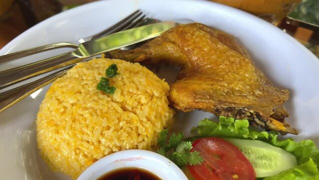 Chicken Teriyaki Food close up establish shot stream chicken with pilau rice on white plate. High quality 4k footage
