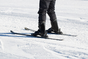 A skier is riding on a mountain. Winter recreation.