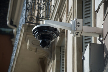 closeup of security camera on building facade in the street - 755008190