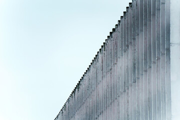 Vertical Concrete Block Wall Overcast Sky