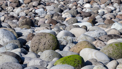 Round stones background from beach in Gran Canaria, Spain