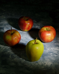 Green and red apples - leadership abstract