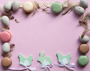 Easter card with decoration. Estare egg, easter bunny and  macaron cookies on pink background with frame with copy space. 
