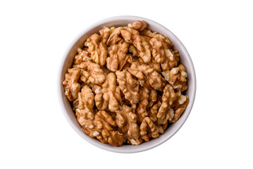Delicious fresh peeled raw walnuts in a ceramic plate - 755027350