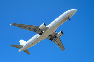 Fototapeta na wymiar Blank white passenger airplane 