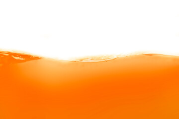 The surface of the orange water ripples looks like juice