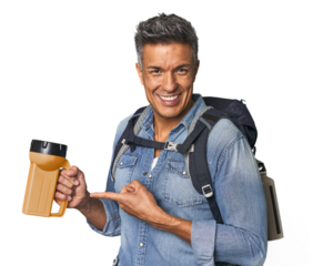 Hispanic trekker with backpack and flashlight smiling and pointing aside, showing something at blank space.