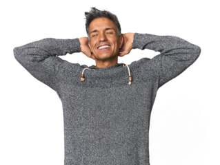 Middle-aged Latino man feeling confident, with hands behind the head.