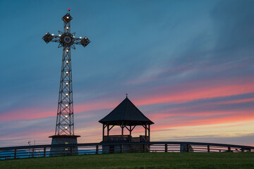 Poland, Litwinka, Czarna Gora. View point and millenium cross on the in the morning sunset.