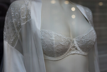 Closeup of white bra on mannequin in a fashion store showroom - 755057953