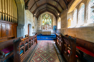 Interior altar and chapel inside the medieval Parish Church of Saint Mary Lower Slaughter, in the...