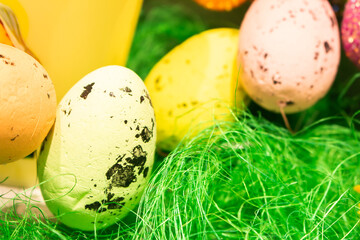 Easter eggs on green grass. Happy Easter decor. Springtime holidays. Easter toys and painted eggs. Traditional spring symbols. - 755074142