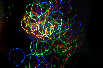 Abstract background with pattern from colorful traces of lights