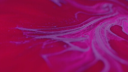 Glitter ink mix. Shimmering swirl. Defocused glowing neon pink purple red color particles texture...