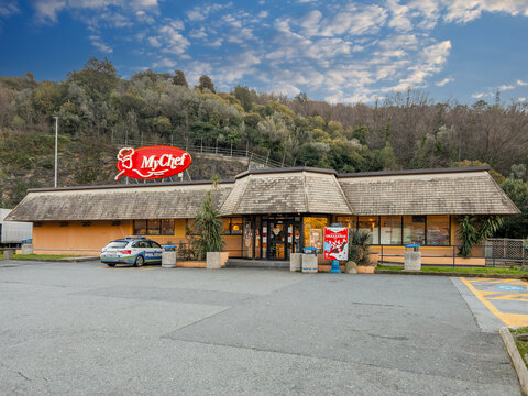San Ilario, Genoa, Italy - March 08, 2024: MyChef restaurant in Sant'Ilario Sud rest area on Azzurra freeway A12 near Genoa, Police car parked in front of diner
