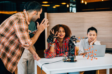 Students and teacher in a classroom learning and having fun on a robotic arm. Illustrating teamwork innovation and education in a playful and engaging setting. Robot hand. technology concept