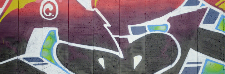 Colorful background of graffiti painting artwork with bright aerosol outlines on wall. Old school...