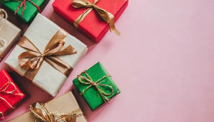 christmas present gift boxes on a pastel pink background