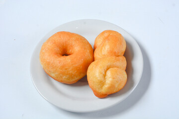 Close up of original donuts without toppings on a white background. Isolated objects