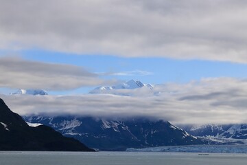 Fototapeta na wymiar Clouds Passing Over Mountain Peaks at Hubbard Glacier in Alaska