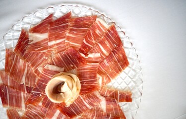 Iberian ham displayed on a plate, beautifully arranged