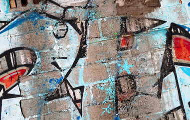 Colorful background of graffiti painting artwork with bright aerosol outlines on wall. Old school...