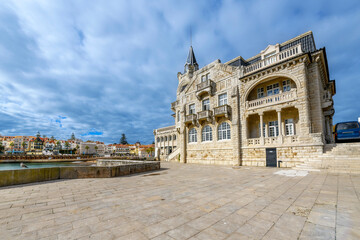 Obraz premium The historic Palacete Seixas Palace with the colorful old town and Mediterranean sea in view, along the Portuguese Riviera at Cascais, Portugal.