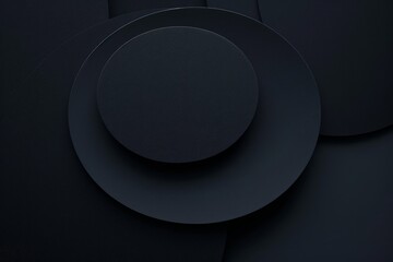 A black plate placed on a black background, creating a minimalist and elegant visual.