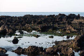 Fototapeta na wymiar View of the rocks on the beach