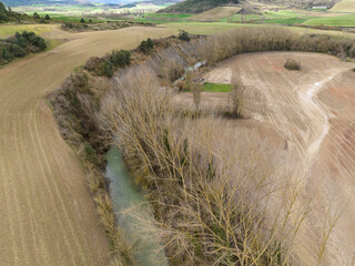 Meander of the river between crop fields. Erro River, Navarra
