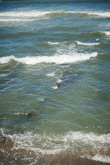 View from above of sea waves pounding on the headland. Atlantic ocean background