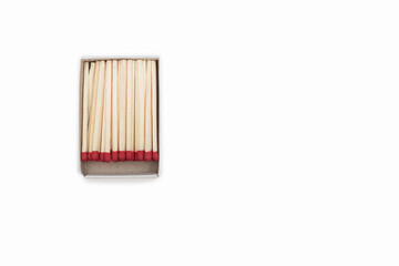 Matches in an open matchbox on a white background. Top view of opened matchbox isolated on white background. Close-up with a blank space for your text