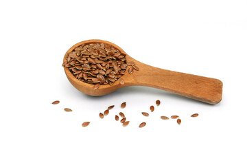 flax seeds in a wooden spoon, isolated on white background. Heap of dry flaxseed or linseed.