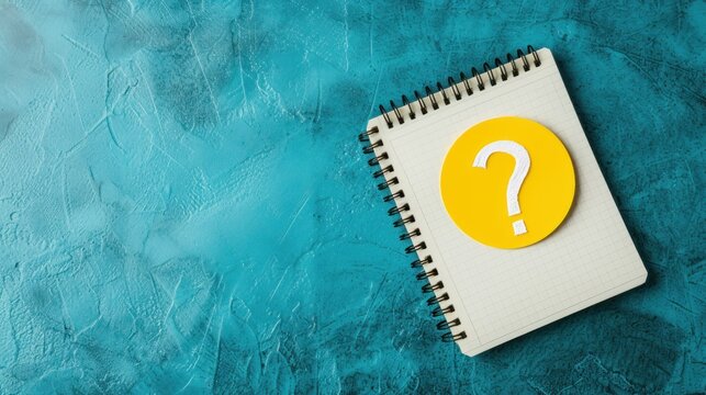 a notepad with a question mark on it next to a spiral notebook with a question mark on the cover.