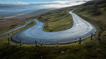 The hairpin bend on the A4069 known as Cuckoo Bend on the Black Mountain Pass in South Wales UK often used in a popular TV car series because of the fast winding roads
 - obrazy, fototapety, plakaty