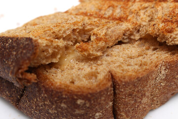 sliced ​​bread texture. brown bread details. toasted bread with cheese.