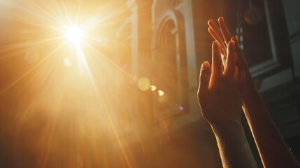 Peaceful soft-focused scene of Christian worship, highlighting a hand raised in devout reverence