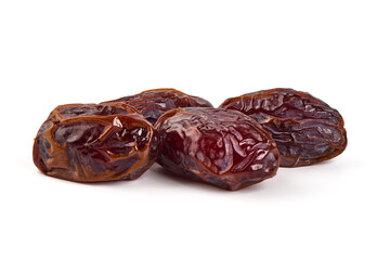 Raw Organic Medjool Dates, isolated on white background.