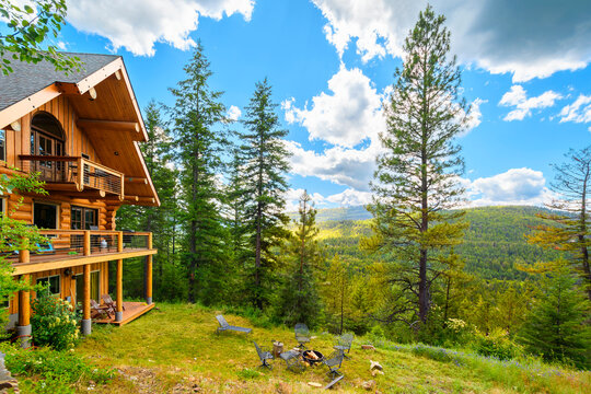 An upscale three story log home in the rural mountains of the North Idaho Panhandle in the Coeur d'Alene Idaho region of the Northwest USA.