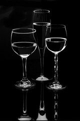 rim light on wine glasses on black background