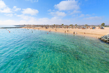 Cruise ship passengers enjoy the sandy beach at the touristic resort and wildlife sanctuary of Sir...