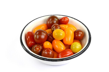 Different sorts of tomatoes isolated on white background.