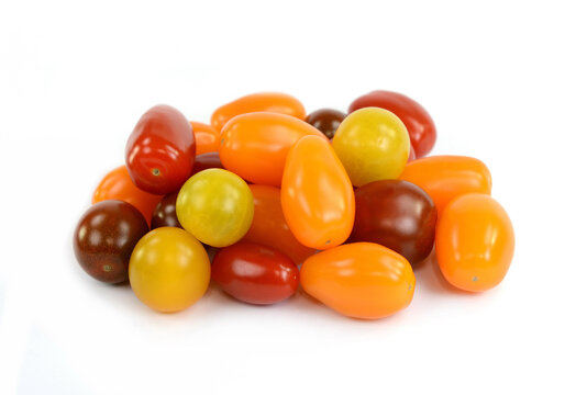 Different sorts of tomatoes isolated on white background.